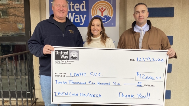 Dave Painter, Amy Rohler, Kent Joesel pose with a check outside the UWAY SCC office.